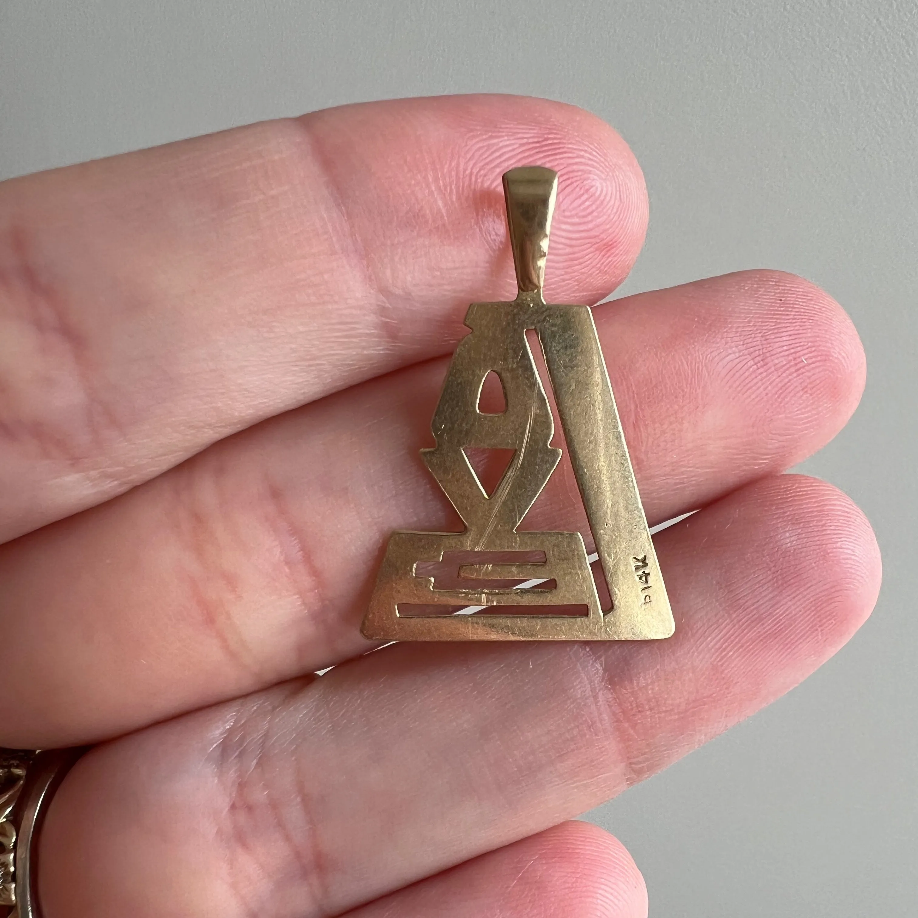 V I N T A G E // 1970s love / 14k yellow gold stylized LOVE / a pendant